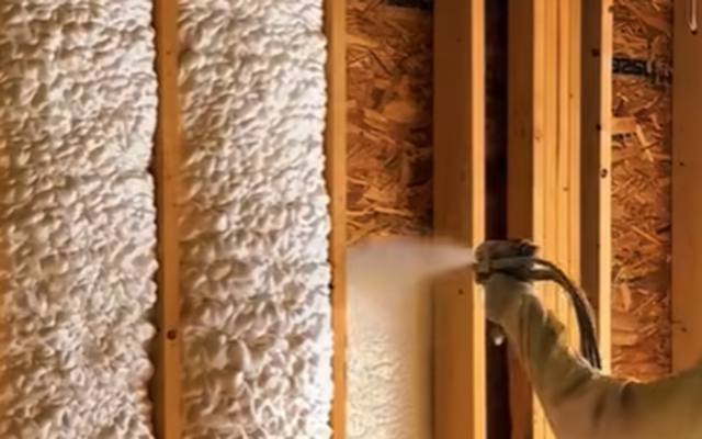 Closed cell spray foam insulation filling the stud bays of an exterior wall in Innisfil, Ontario